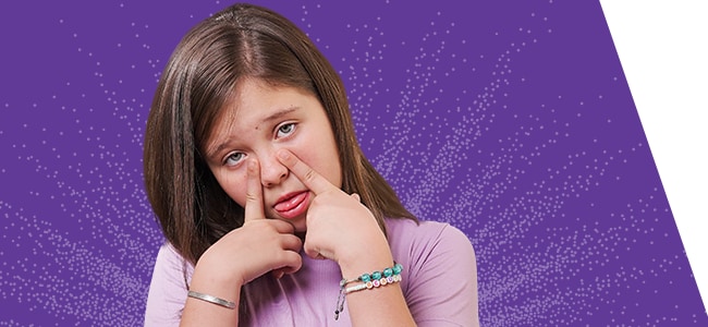 woman with nasal congestion touching nose with both pointer fingers on purple background